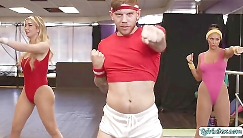 Tattooed girl has her body stretched and she is giving a blowjob